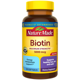 Nature Made Biotin Maximum Strength 5000 mcg Softgels supplement bottle with Supports healthy skin and hair, energy metabolism support benefit label with a yellow cap.